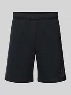 Spodnie sportowe męskie - Szorty z dzianiny dresowej o kroju tapered fit z nadrukiem z logo - miniaturka - grafika 1