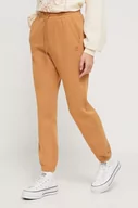 Spodnie damskie - Billabong spodnie dresowe kolor brązowy gładkie - miniaturka - grafika 1