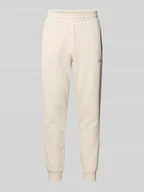 Spodnie sportowe męskie - Spodnie dresowe z wyhaftowanym logo i elastycznym pasem - miniaturka - grafika 1