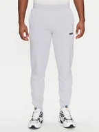 Spodnie sportowe męskie - Puma Spodnie dresowe Ess 684714 Błękitny Regular Fit - miniaturka - grafika 1