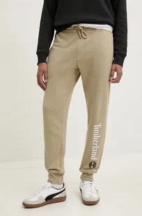 Timberland spodnie dresowe kolor beżowy z nadrukiem TB0A5YFBDH41 - Spodnie męskie - miniaturka - grafika 1