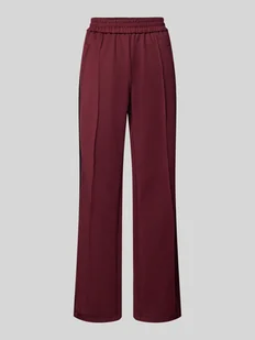 Spodnie typu track pants o luźnym kroju z paskami w kontrastowym kolorze model ‘WARM UP X’ - Spodnie damskie - miniaturka - grafika 1