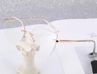 Okulary korekcyjne, oprawki, szkła - Damskie bezramkowe kocie okulary zerówki do komputera BLUE LIGHT z flexami 25112 złote - miniaturka - grafika 1