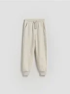 Spodnie i spodenki dla chłopców - Reserved - Bawełniane spodnie jogger - beżowy - miniaturka - grafika 1