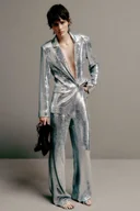 Spodnie damskie - Spodnie flare ozdobione cekinami - miniaturka - grafika 1