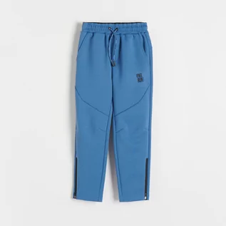 Spodnie i spodenki dla chłopców - Reserved - Sportowe joggery z zamkami - Niebieski - grafika 1