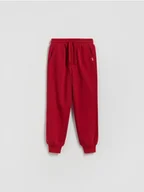Spodnie i spodenki dla chłopców - Reserved - Bawełniane spodnie jogger - czerwony - miniaturka - grafika 1
