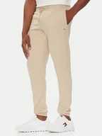 Spodnie sportowe męskie - Tommy Jeans Spodnie dresowe Flag DM0DM20473 Beżowy Slim Fit - miniaturka - grafika 1