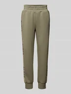 Spodnie sportowe damskie - Spodnie dresowe o kroju slim fit z nadrukami z logo - miniaturka - grafika 1