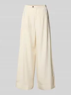 Spodnie damskie - Spodnie z zakładkami w pasie, szerokimi nogawkami i wpuszczanymi kieszeniami model ‘NATUK’ - miniaturka - grafika 1