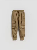 Spodnie i spodenki dla chłopców - Reserved - Joggery z kieszeniami - beżowy - miniaturka - grafika 1