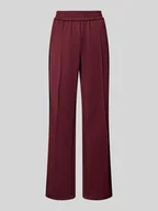 Spodnie damskie - Spodnie typu track pants o luźnym kroju z paskami w kontrastowym kolorze model ‘WARM UP X’ - miniaturka - grafika 1