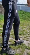 Spodnie sportowe męskie - Spodnie czarne z białą taśmą Furia - miniaturka - grafika 1