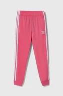 Spodnie i spodenki dla dziewczynek - adidas Originals spodnie dresowe dziecięce kolor różowy z aplikacją - miniaturka - grafika 1