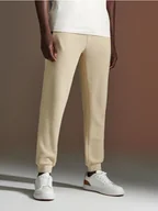 Spodnie męskie - Sinsay - Spodnie dresowe - kremowy - miniaturka - grafika 1