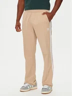 Spodnie sportowe męskie - adidas Spodnie dresowe adicolor 70's IX5221 Beżowy Regular Fit - miniaturka - grafika 1