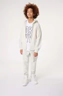 Spodnie i spodenki dla dziewczynek - Dkny spodnie dresowe bawełniane dziecięce kolor biały z nadrukiem - DKNY - miniaturka - grafika 1