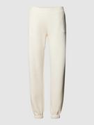 Spodnie sportowe damskie - Spodnie dresowe o kroju regular fit z nadrukiem z logo - miniaturka - grafika 1