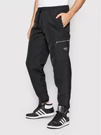Spodnie sportowe męskie - Adidas Spodnie dresowe Cargo H59875 Czarny Regular Fit - miniaturka - grafika 1