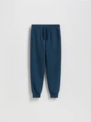 Spodnie i spodenki dla chłopców - Reserved - Joggery z bawełną - granatowy - miniaturka - grafika 1