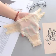 Majtki damskie - Stringi z rozcięciem na boku - Beżowy - miniaturka - grafika 1