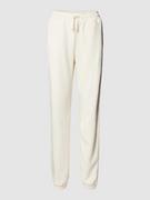 Spodnie sportowe damskie - Spodnie dresowe z elastycznym pasem model ‘SAKI’ - miniaturka - grafika 1