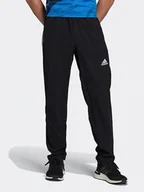 Spodnie sportowe męskie - Adidas Spodnie sportowe "M TI WV PT" w kolorze czarno-białym - miniaturka - grafika 1