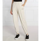 Dresy damskie - Calvin Klein Jeans Spodnie dresowe | Relaxed fit - miniaturka - grafika 1