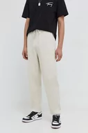 Spodnie męskie - Tommy Jeans spodnie dresowe bawełniane kolor beżowy gładkie - miniaturka - grafika 1