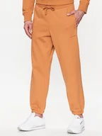 Spodnie sportowe męskie - New Balance Spodnie dresowe MP23551 Pomarańczowy Relaxed Fit - miniaturka - grafika 1