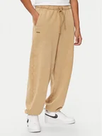 Spodnie sportowe męskie - Under Armour Spodnie dresowe UA Icon 1386554 Beżowy Loose Fit - miniaturka - grafika 1