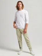 Spodnie sportowe męskie - Superdry Spodnie dresowe w kolorze beżowym - miniaturka - grafika 1