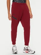 Spodnie sportowe męskie - Under Armour Spodnie dresowe UA Unstoppable 1389353 Czerwony Regular Fit - miniaturka - grafika 1