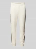 Spodnie sportowe męskie - Spodnie dresowe o kroju slim fit z elastycznym pasem - miniaturka - grafika 1