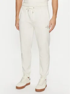 Calvin Klein Jeans Spodnie dresowe Monologo Hwk Pant J30J325658 Écru Regular Fit - Spodnie sportowe męskie - miniaturka - grafika 1