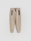 Spodnie i spodenki dla chłopców - Reserved - Bawełniane spodnie jogger - beżowy - miniaturka - grafika 1