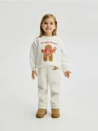 Spodnie i spodenki dla dziewczynek - Reserved - Spodnie ze świąteczną aplikacją - złamana biel - miniaturka - grafika 1