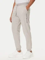 Spodnie sportowe męskie - Tommy Hilfiger Spodnie dresowe UM0UM03664 Beżowy Regular Fit - miniaturka - grafika 1