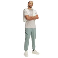 Spodnie męskie - Męskie spodnie treningowe Under Armour UA Unstoppable Joggers - zielone - miniaturka - grafika 1