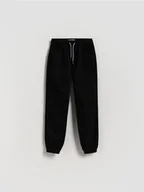 Spodnie i spodenki dla chłopców - Reserved - Bawełniane spodnie jogger - czarny - miniaturka - grafika 1