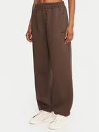 Spodnie sportowe damskie - Reebok Spodnie dresowe Reebok X Ewa Chodakowska RK25304CCW Brązowy Regular Fit - miniaturka - grafika 1