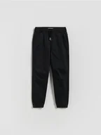 Spodnie i spodenki dla chłopców - Reserved - Wysokoelastyczne spodnie jogger - czarny - miniaturka - grafika 1