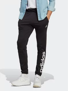 Spodnie sportowe męskie - adidas Spodnie dresowe Essentials Single Jersey Tapered Elasticized Cuff Logo Joggers IC0055 Czarny Regular Fit - grafika 1