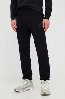 Spodnie męskie - The North Face spodnie dresowe bawełniane kolor czarny z nadrukiem - grafika 1