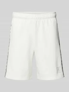 Szorty z dzianiny dresowej o kroju tapered fit z nadrukiem z logo - Spodnie sportowe męskie - miniaturka - grafika 1