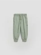 Spodenki dla niemowląt - Reserved - Bawełniane joggery - jasnozielony - miniaturka - grafika 1