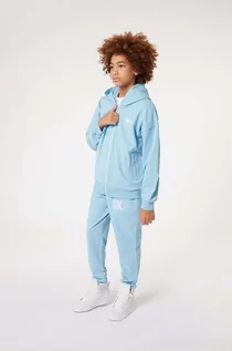 Spodnie i spodenki dla dziewczynek - Dkny spodnie dresowe bawełniane dziecięce kolor niebieski z nadrukiem - DKNY - grafika 1