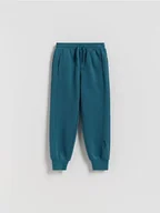 Spodnie i spodenki dla chłopców - Reserved - Dzianinowe joggery - ciemny turkus - miniaturka - grafika 1