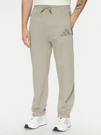 Spodnie sportowe męskie - adidas Spodnie dresowe Z.N.E. Open-Hem JC6716 Beżowy Loose Fit - miniaturka - grafika 1