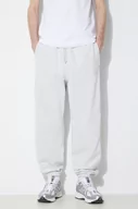 Spodnie męskie - New Balance spodnie dresowe bawełniane kolor szary z aplikacją - miniaturka - grafika 1
